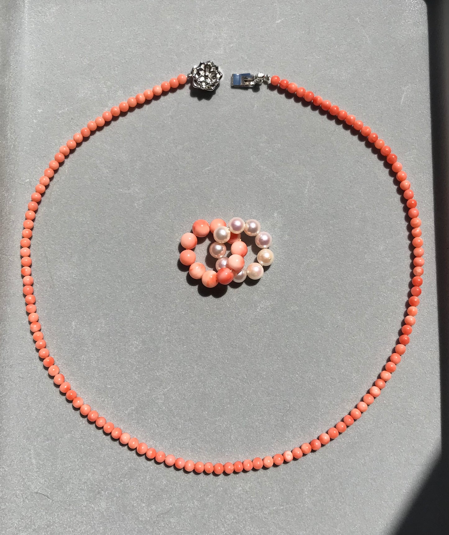 Pink coral and Akoya pearl interlocking circles pendant