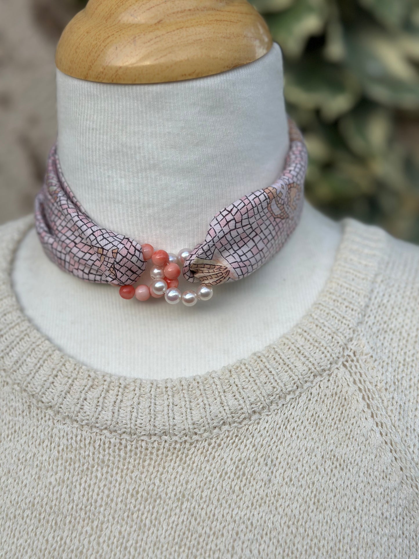 Pink coral and Akoya pearl interlocking circles pendant